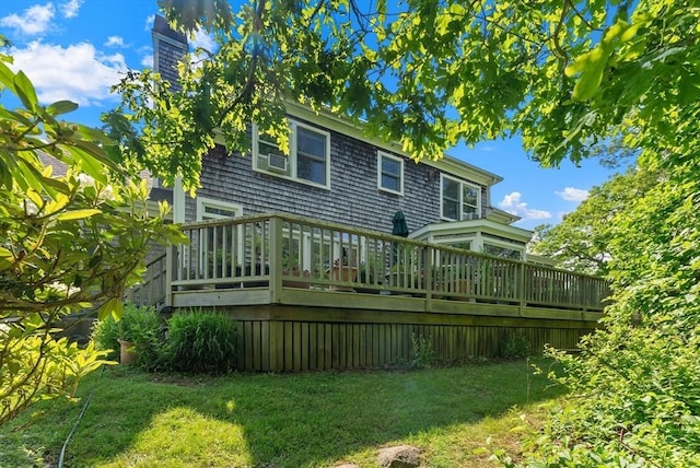56 Bridle Path, Tisbury, MA 02567 - rear view of house featuring a deck, a chimney, and a yard