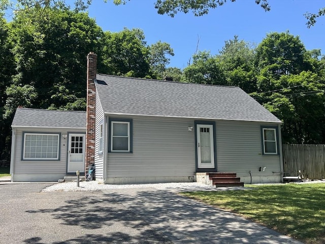 14 Adams Rd, Ashland, MA 01721 - view of front of property with entry steps, a chimney, and roof with shingles