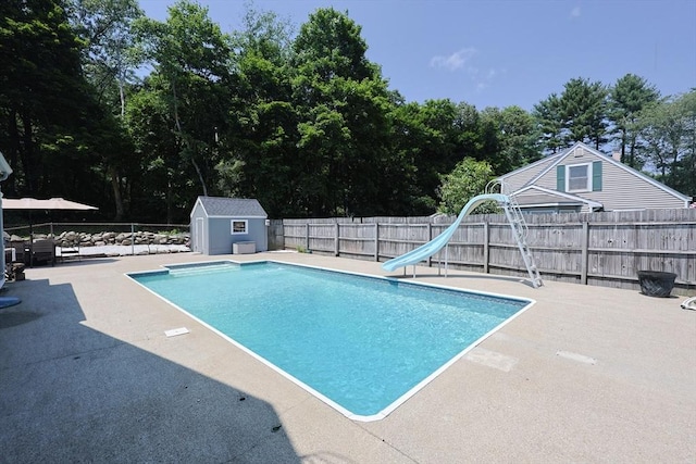 14 Adams Rd, Ashland, MA 01721 - view of swimming pool featuring a water slide, a fenced backyard, a patio, and a shed