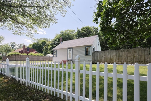 14 Adams Rd, Ashland, MA 01721 - view of front of home with a fenced backyard