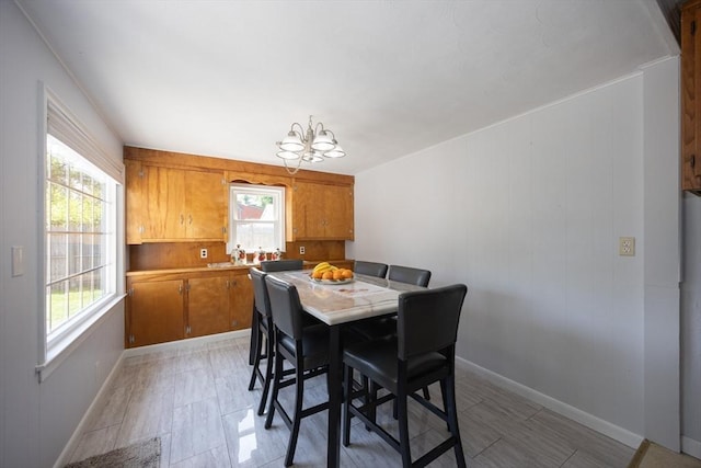 14 Adams Rd, Ashland, MA 01721 - dining room featuring a chandelier and baseboards