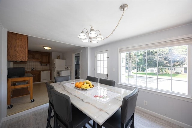 14 Adams Rd, Ashland, MA 01721 - dining room with a chandelier and baseboards