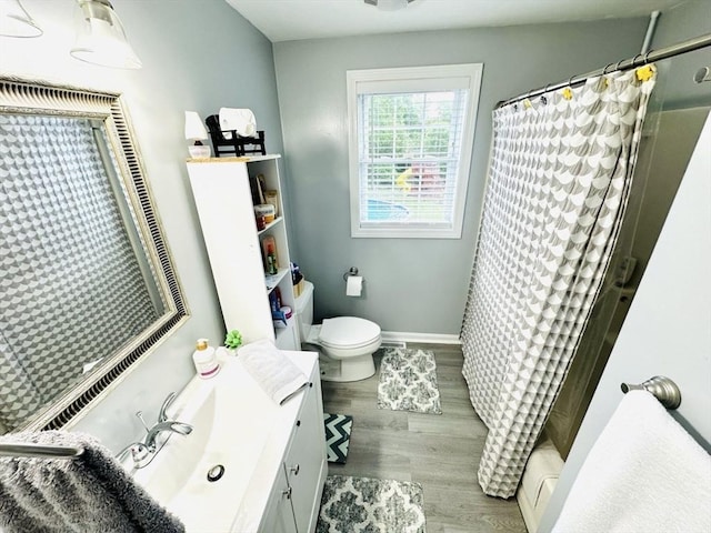 38 Thayer Ave, Whitman, MA 02382 - bathroom featuring vanity, toilet, wood finished floors, and baseboards
