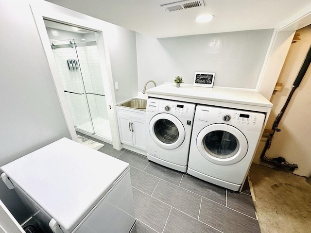 38 Thayer Ave, Whitman, MA 02382 - washroom with cabinet space, washer and clothes dryer, and dark tile patterned floors