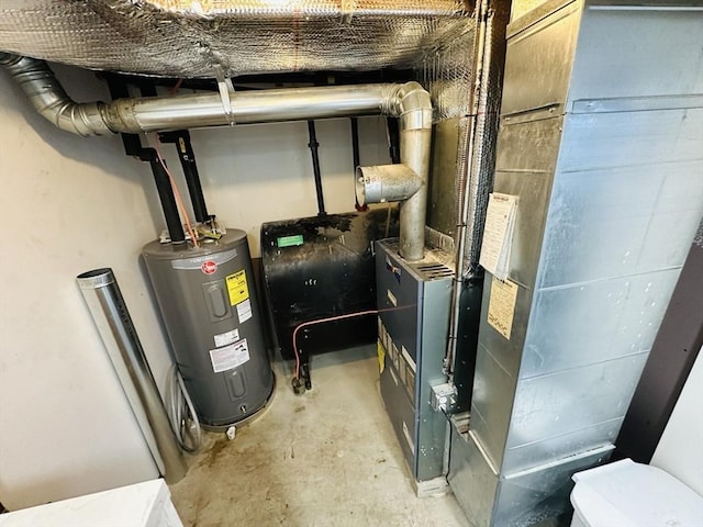 38 Thayer Ave, Whitman, MA 02382 - utility room featuring electric water heater, heating unit, and oil tank