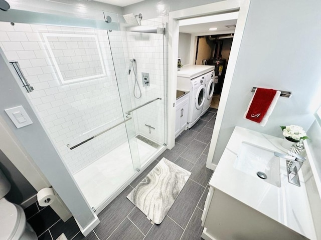38 Thayer Ave, Whitman, MA 02382 - bathroom featuring vanity, a stall shower, toilet, independent washer and dryer, and water heater