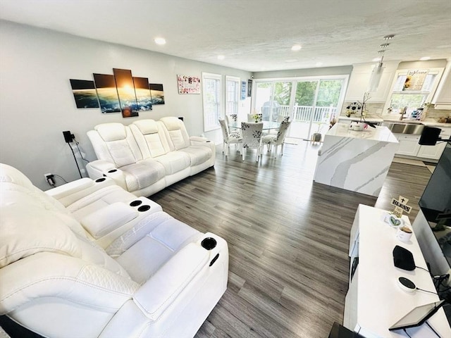 38 Thayer Ave, Whitman, MA 02382 - living room with recessed lighting and dark wood-style flooring