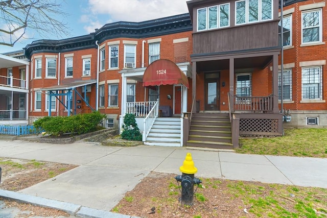 view of front of house with brick siding