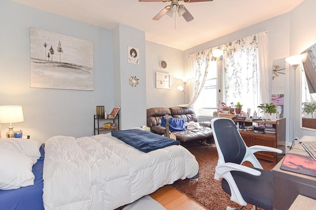 bedroom with wood finished floors and a ceiling fan