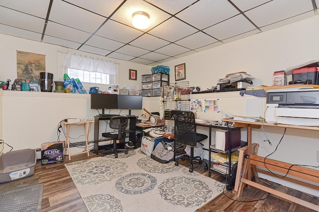 office area featuring a paneled ceiling and wood finished floors