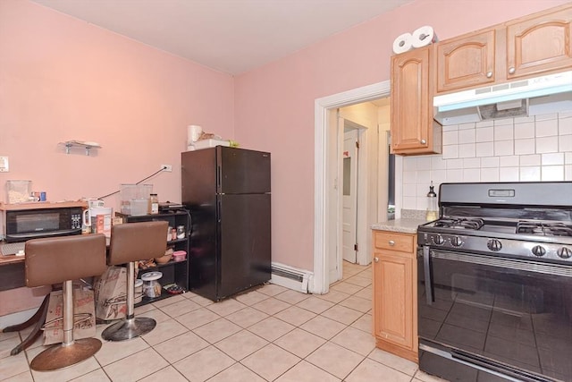 kitchen featuring light brown cabinets, decorative backsplash, black appliances, under cabinet range hood, and a baseboard heating unit