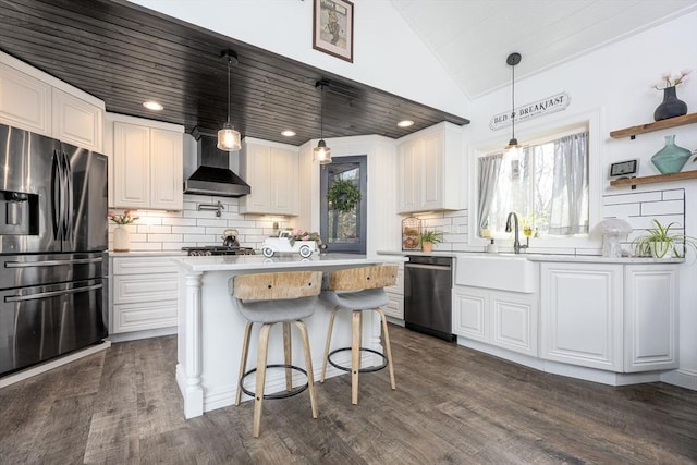 20 Bailey Shr, Hampstead, NH 03841 - kitchen with appliances with stainless steel finishes, lofted ceiling, wall chimney exhaust hood, light countertops, and white cabinetry