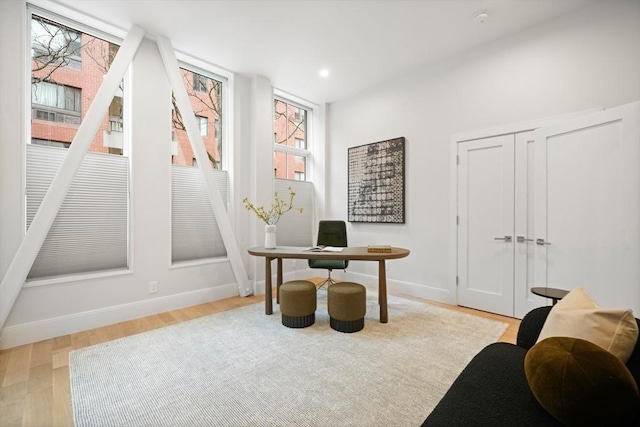 office with recessed lighting, baseboards, and light wood finished floors