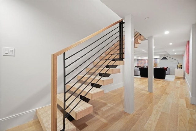 stairs featuring recessed lighting, baseboards, and wood finished floors
