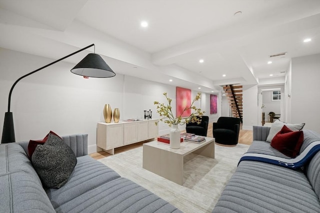 living room with visible vents, stairs, baseboards, light wood-style floors, and recessed lighting