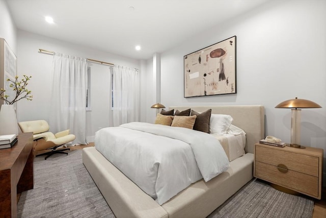 bedroom featuring recessed lighting and wood finished floors