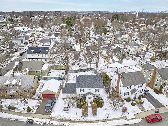 snowy aerial view featuring a residential view