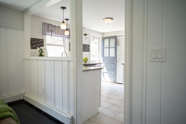 hallway featuring baseboard heating