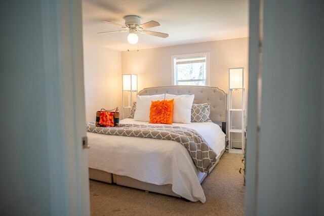 carpeted bedroom featuring ceiling fan