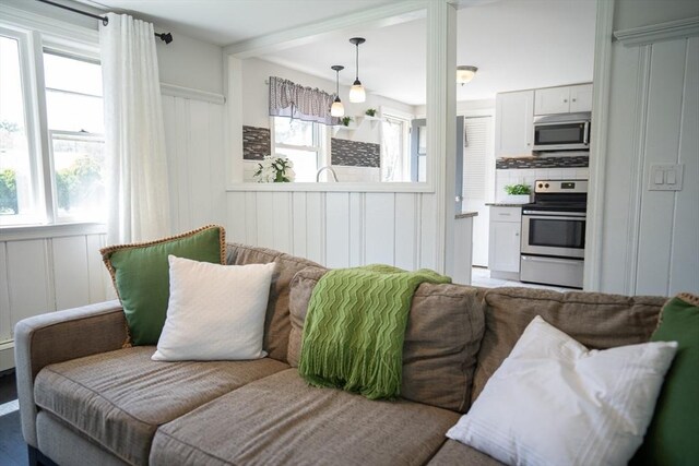 living room featuring a decorative wall
