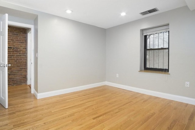 unfurnished room featuring baseboards, recessed lighting, light wood-style flooring, and visible vents