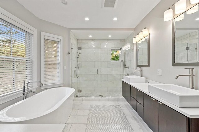33 Winthrop Unit 1, Brookline, MA 02445 - bathroom with healthy amount of natural light, a freestanding tub, a shower stall, and recessed lighting