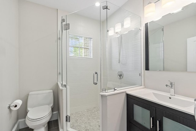 33 Winthrop Unit 1, Brookline, MA 02445 - bathroom with toilet, vanity, a stall shower, and baseboards
