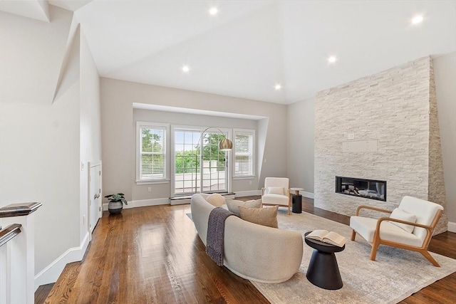 33 Winthrop Unit 1, Brookline, MA 02445 - living area with wood finished floors, a fireplace, baseboards, lofted ceiling, and recessed lighting