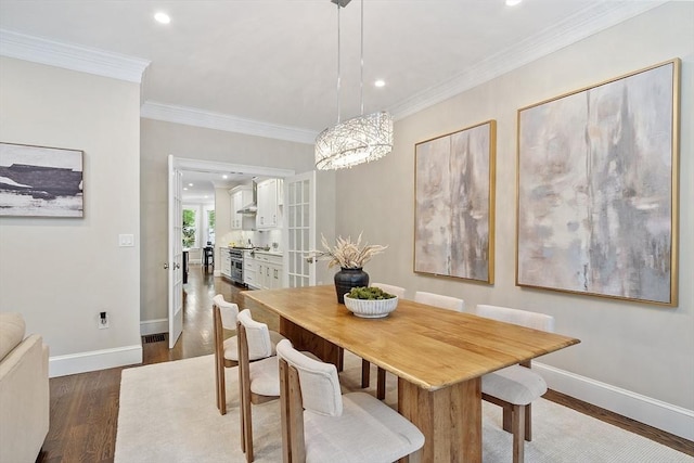 33 Winthrop Unit 1, Brookline, MA 02445 - dining area with dark wood-type flooring, baseboards, ornamental molding, recessed lighting, and a chandelier