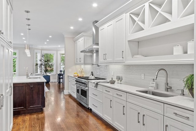 33 Winthrop Unit 1, Brookline, MA 02445 - kitchen with range with two ovens, wall chimney range hood, a sink, crown molding, and white cabinets