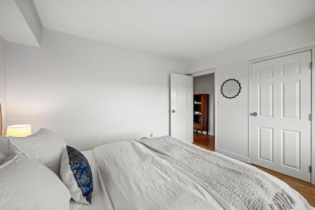 bedroom with wood-type flooring