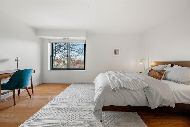 bedroom with light hardwood / wood-style floors