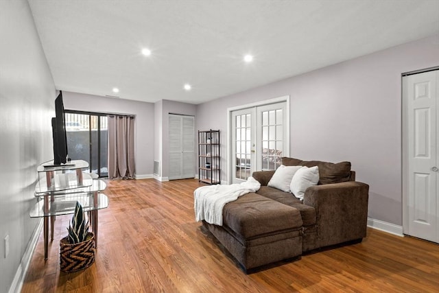 living room featuring hardwood / wood-style flooring and french doors