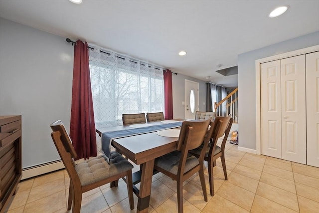 dining room with light tile patterned floors, recessed lighting, stairs, and a baseboard heating unit