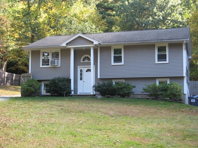 split foyer home featuring a front lawn