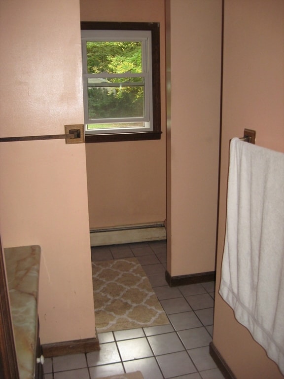 bathroom featuring tile patterned floors and baseboard heating