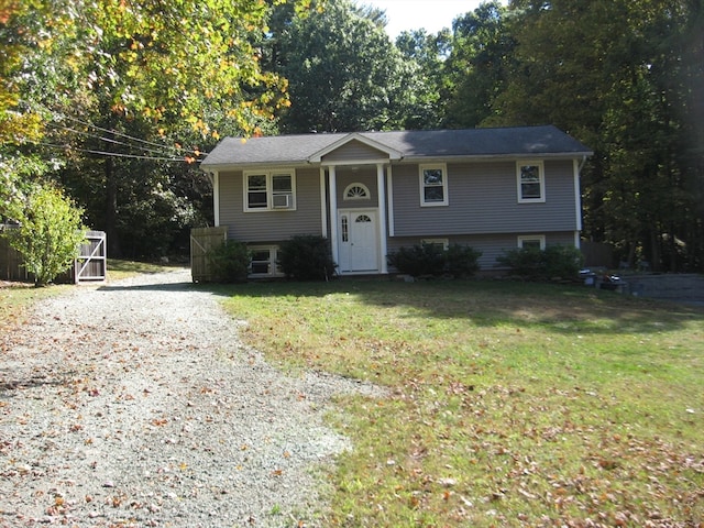 split foyer home with a front lawn