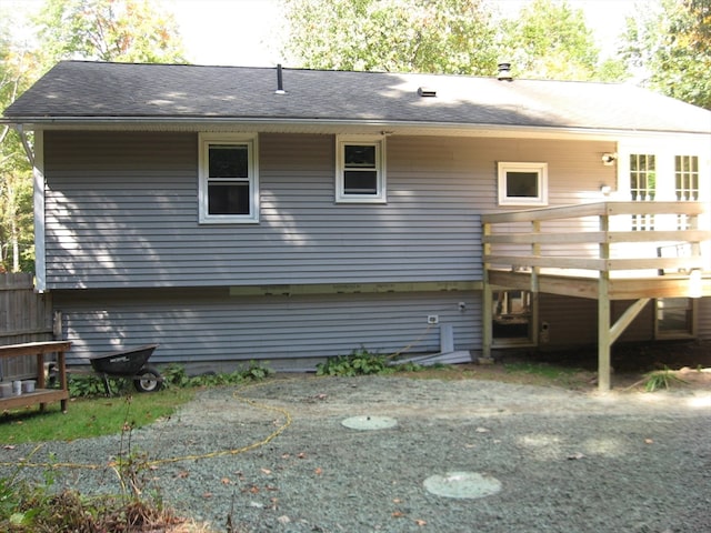 rear view of house featuring a deck