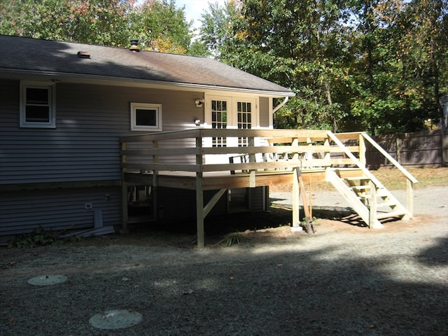 back of property featuring a wooden deck