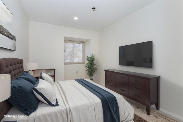 bedroom with recessed lighting, baseboards, and light carpet