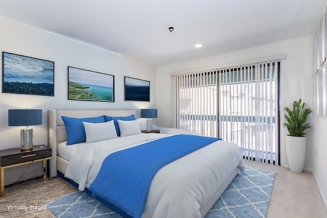 carpeted bedroom featuring access to outside