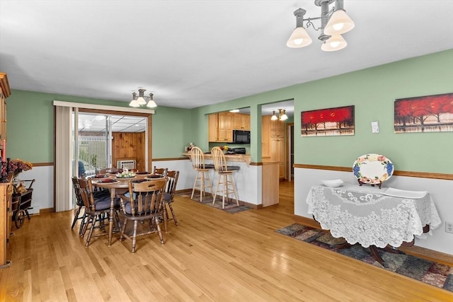 15 Cushing St, Salisbury, MA 01952 - dining area featuring a chandelier and light wood finished floors
