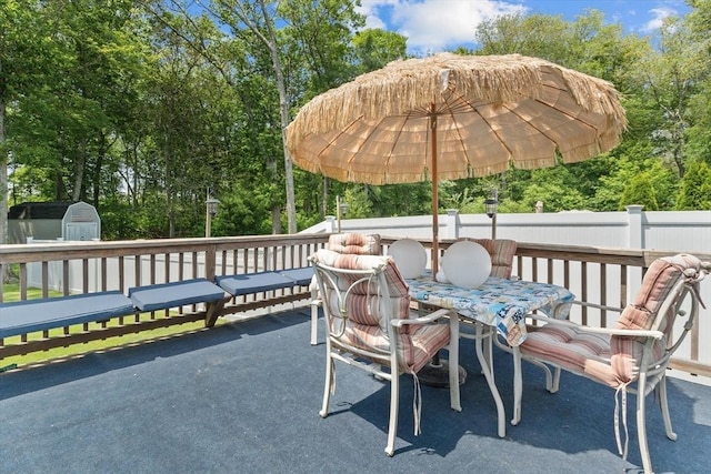 15 Cushing St, Salisbury, MA 01952 - view of patio / terrace with a shed, outdoor dining area, and view of scattered trees