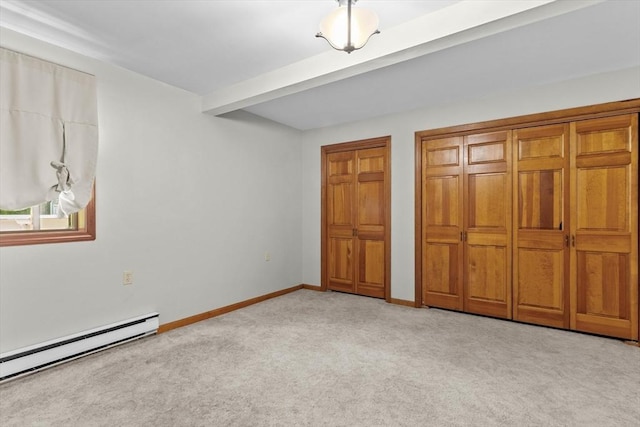 15 Cushing St, Salisbury, MA 01952 - unfurnished bedroom featuring carpet, a baseboard radiator, and two closets