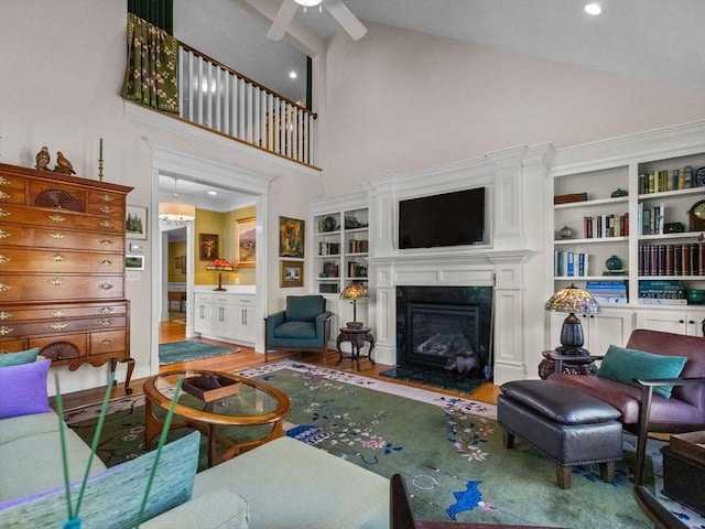 8 Sandstone Dr Unit 8, Medway, MA 02053 - living room with high vaulted ceiling, a premium fireplace, a ceiling fan, wood finished floors, and recessed lighting