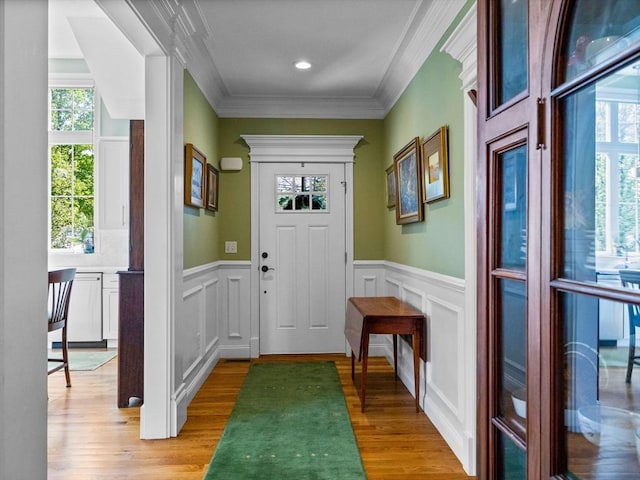 8 Sandstone Dr Unit 8, Medway, MA 02053 - doorway with plenty of natural light, light wood-type flooring, a decorative wall, wainscoting, and crown molding