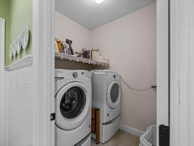 8 Sandstone Dr Unit 8, Medway, MA 02053 - laundry area with washer and dryer, light tile patterned floors, and baseboards