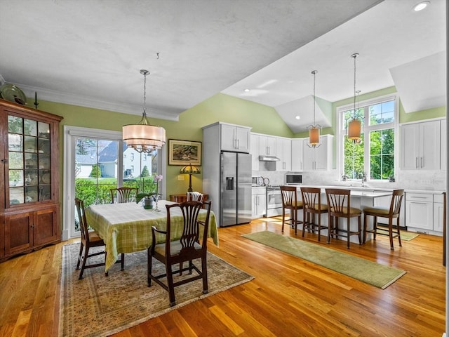 8 Sandstone Dr Unit 8, Medway, MA 02053 - dining area with healthy amount of natural light, light wood finished floors, vaulted ceiling, a chandelier, and recessed lighting
