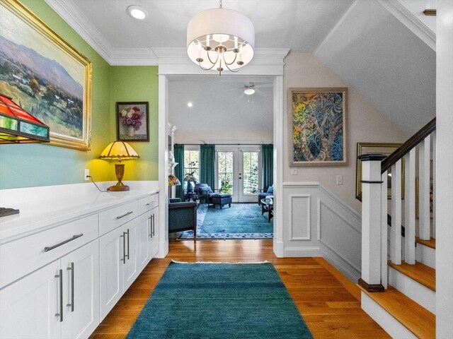 8 Sandstone Dr Unit 8, Medway, MA 02053 - foyer with french doors, stairway, wood finished floors, ornamental molding, and wainscoting