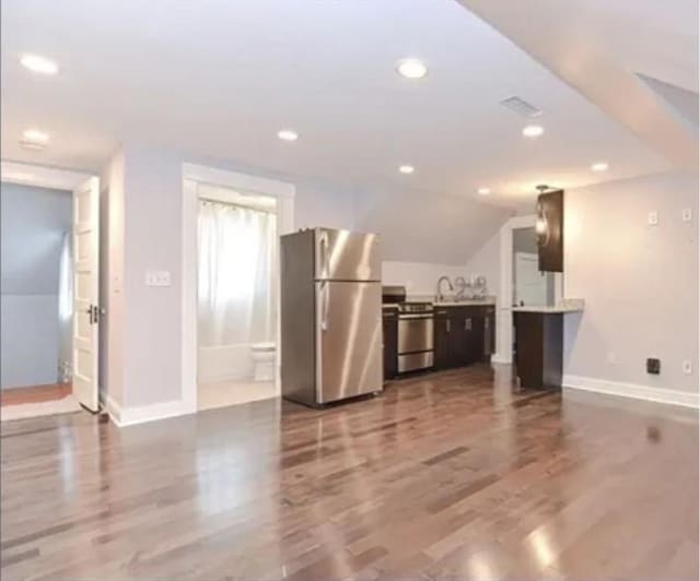 75 William St, Worcester, MA 01609 - unfurnished living room featuring baseboards, wood finished floors, recessed lighting, and a sink